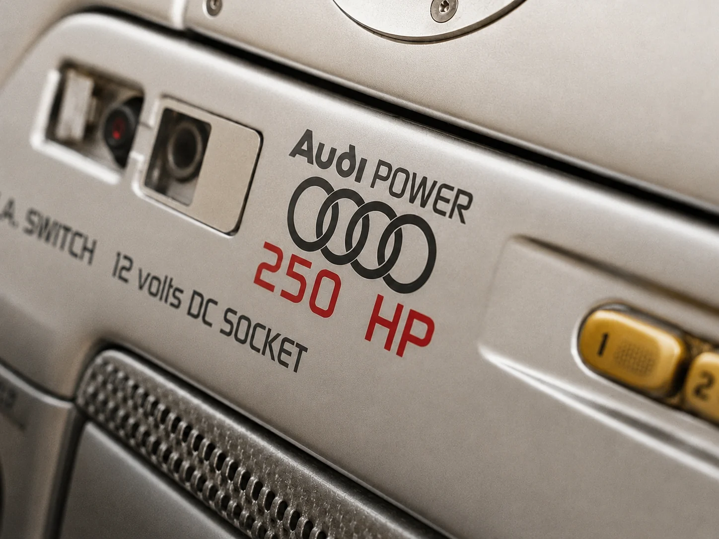 The Audi Power 250 HP marking applied to the flank beside the service panel